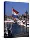 Raising the Dutch Flag by the Harbour, Volendam, Ijsselmeer, Holland-I Vanderharst-Premier Image Canvas