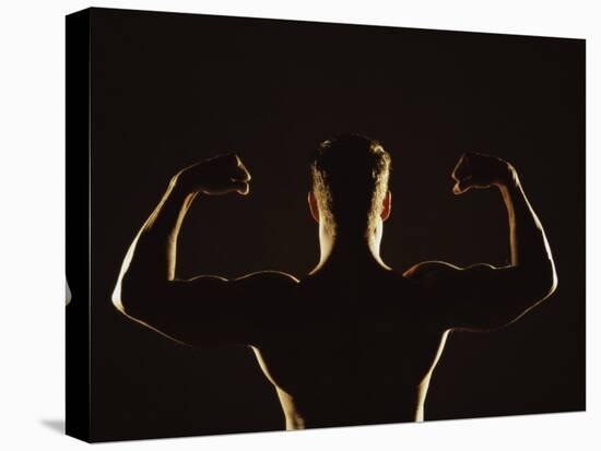 Rear View of a Young Man Flexing His Muscles-null-Premier Image Canvas