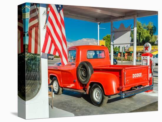 Red Dodge Pickup truck parked in front of vintage gas station in Santa Paula, California-null-Premier Image Canvas