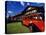 Red Jammer Buses Parked in Front of Glacier Park Lodge in East Glacier, Montana, USA-Chuck Haney-Premier Image Canvas