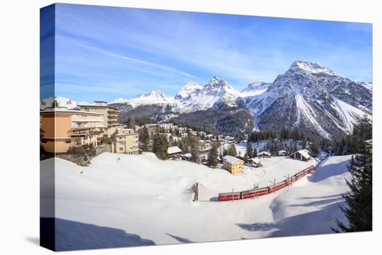 Red train of Rhaetian Railway passes in the snowy landscape of Arosa, district of Plessur, Canton o-Roberto Moiola-Premier Image Canvas