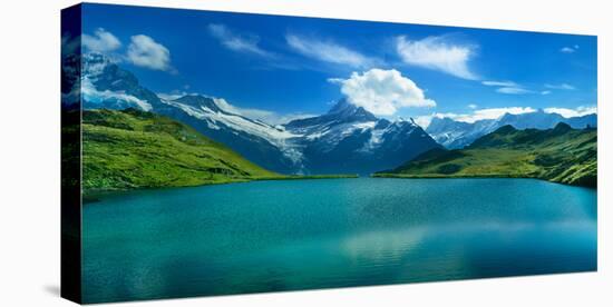 Reflection of clouds and mountain in a lake, Bachalpsee, Grindelwald, Bernese Oberland, Switzerland-null-Stretched Canvas