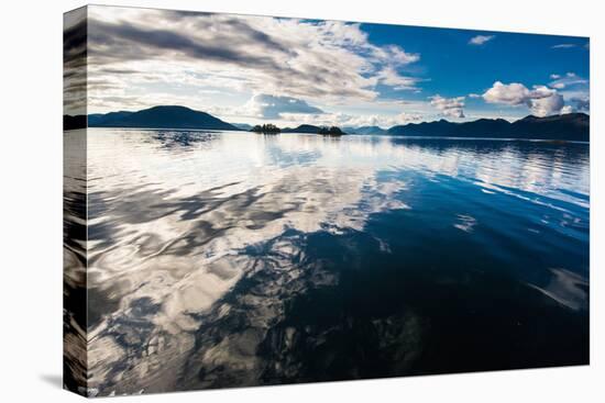 Reflections in the calm waters of the Inside Passage, Southeast Alaska, USA-Mark A Johnson-Premier Image Canvas