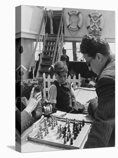 Refugees Playing a Game of Chess on the Ss Sinaia from Marseille During World War Ii-Robert Hunt-Premier Image Canvas