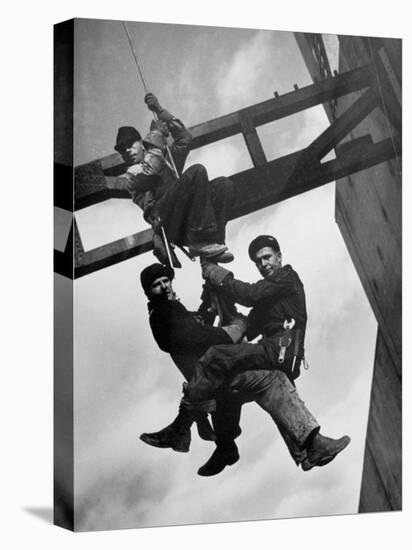 Relief Workers Hanging from Cable in Front of a Giant Beam During the Construction of Fort Peck Dam-Margaret Bourke-White-Premier Image Canvas