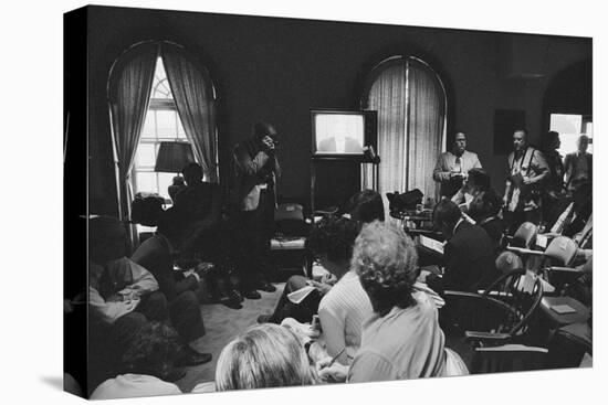 Reporters watch President Carter making TV announcement on aborted Iran rescue, 1980-Marion S. Trikosko-Premier Image Canvas
