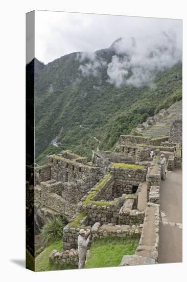 Restoration work at the Inca ruins of Machu Picchu, UNESCO World Heritage Site, Peru, South America-Julio Etchart-Premier Image Canvas