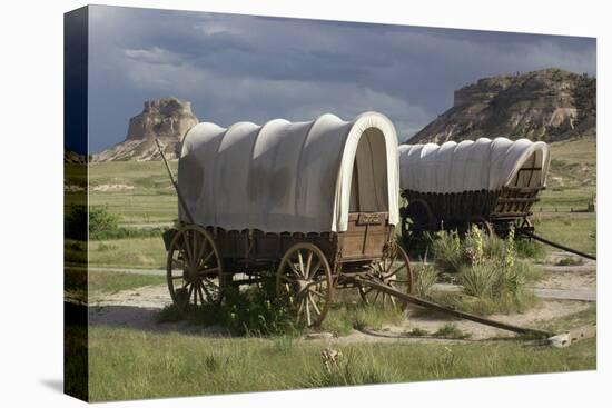 Restored Covered Wagons (Conestoga Wagon at Rear), at Scotts Bluff on the Oregon Trail in Nebraska-null-Premier Image Canvas