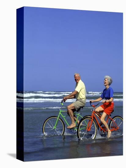 Retired Couple Riding Bikes at the Beach-Bill Bachmann-Premier Image Canvas