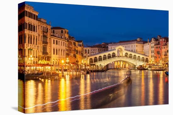 Rialto Bridge (Ponte di Rialto) at night with boat light trails on the Grand Canal, Venice, Veneto-Neale Clark-Premier Image Canvas