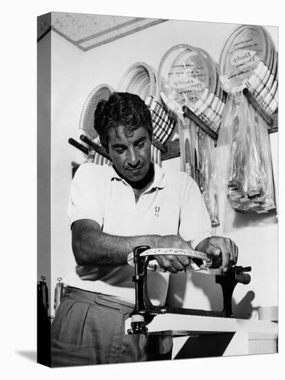 Richard 'Pancho' Gonzales Restringing a Tennis Racket in 1962-null-Stretched Canvas