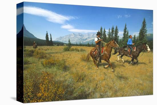 Riding in Banff National Park, Alberta, Canada-null-Stretched Canvas