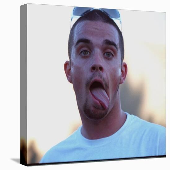 Robbie Williams Sticking His Tongue Out to Photographers at T in the Park Festival-null-Premier Image Canvas