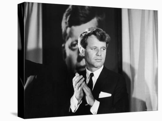 Robert F. Kennedy Campaigning in Front of Poster Portrait of His Brother President John F. Kennedy-Bill Eppridge-Premier Image Canvas