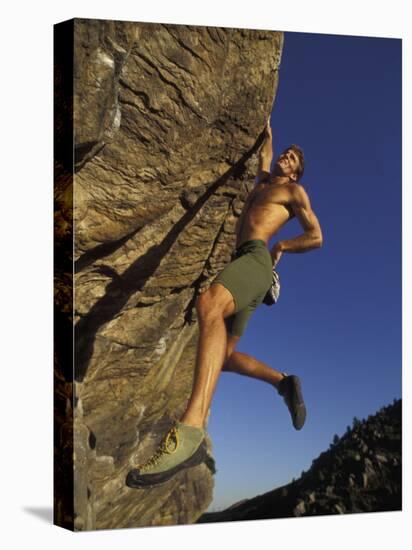 Rock Climber Hanging from Grip-null-Premier Image Canvas