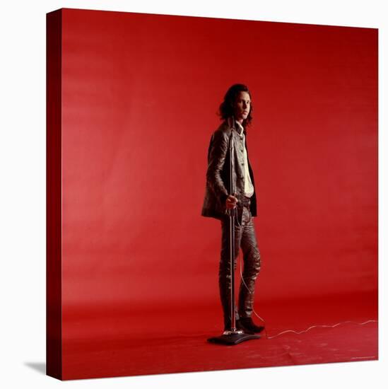 Rock Star Jim Morrison of the Doors Standing Alone Next to Microphone in Front of a Red Backdrop-Yale Joel-Premier Image Canvas