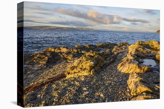 Rocky shore near Catacol looking out across the Kilbrannan Sound to Mull of Kintyre, Isle of Arran,-Gary Cook-Premier Image Canvas