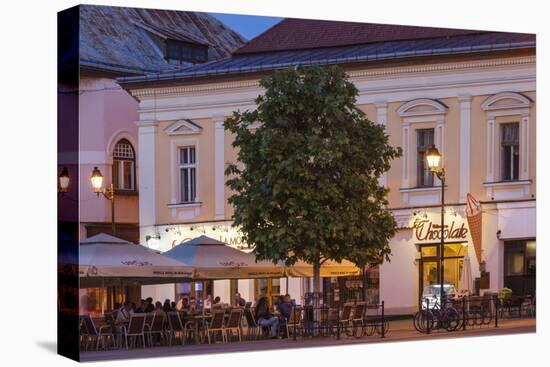 Romania, Baia Mare, Piata Libertatii Square, Outdoor Cafes, Dusk-Walter Bibikow-Premier Image Canvas