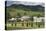 Romania, Maramures Region, Rona de Jos, Village View with Haystacks-Walter Bibikow-Premier Image Canvas