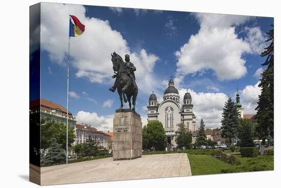 Romania, Transylvania, Targu Mures, Statue and Orthodox Cathedral-Walter Bibikow-Premier Image Canvas