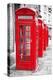 Row Of Iconic London Red Phone Cabins With The Rest Of The Picture In Black And White-Kamira-Premier Image Canvas