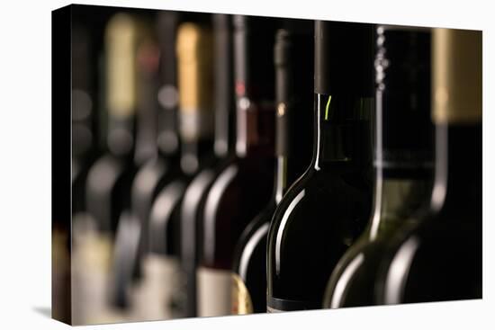 Row of Vintage Wine Bottles in a Wine Cellar (Shallow Dof; Color Toned Image)-l i g h t p o e t-Premier Image Canvas