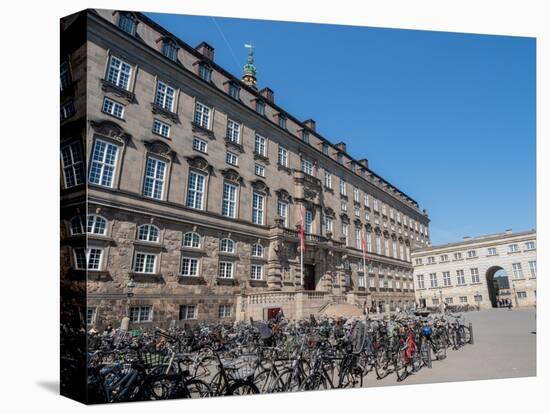 Rows of bicycles outside the Christiansborgs Palace, home of the Danish Parliament, Copenhagen-Jean Brooks-Premier Image Canvas