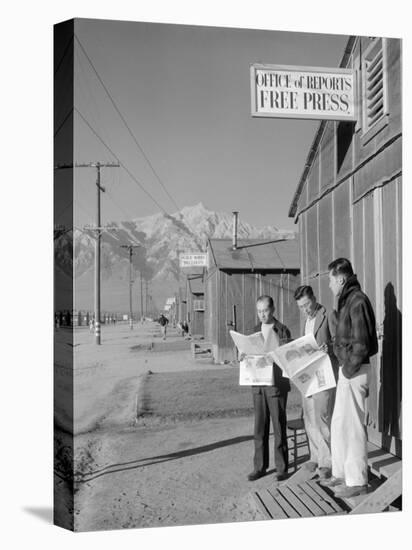 Roy Takeno, Editor, and Group, Manzanar Relocation Center, California-Ansel Adams-Stretched Canvas