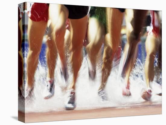Runners Legs Splashing Through Water Jump of Track and Field Steeplechase Race, Sydney, Australia-Paul Sutton-Premier Image Canvas