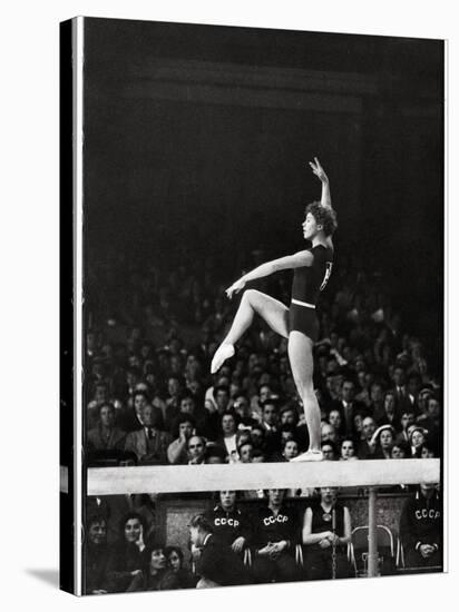 Russian Gymnast Larisa Latynina Competing on the High Beam in the Olympics-John Dominis-Premier Image Canvas