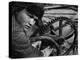 Russian Steel Worker Turning Gear Wheel in a Steel Mill-Margaret Bourke-White-Premier Image Canvas