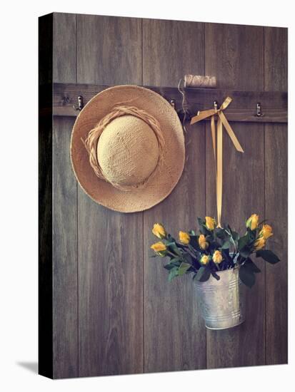 Rustic Shed Door with Hanging Straw Hat and Bucket of Yellow Roses-Chris_Elwell-Premier Image Canvas