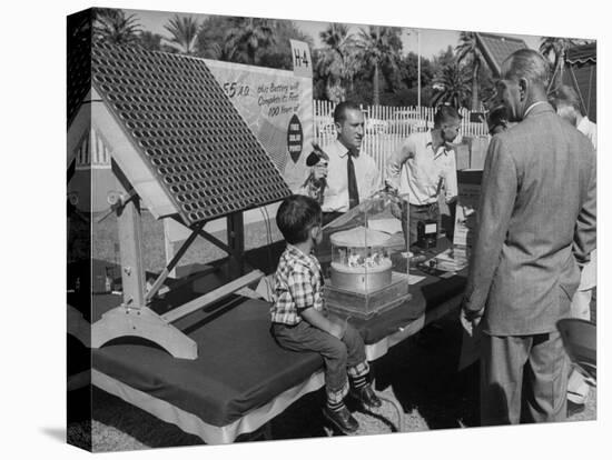 Salesman Demonstrating Solar Battery at the International Conference on Solar Energy-J^ R^ Eyerman-Premier Image Canvas