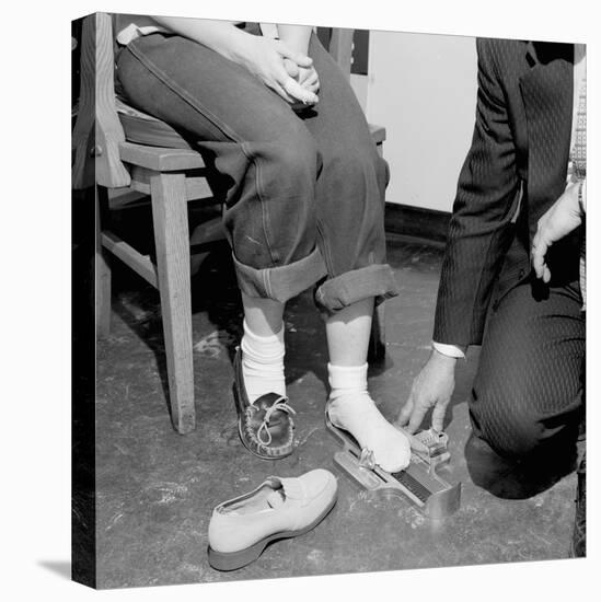 Salesmen Helps Woman with Safety Work Shoes, Ca. 1943-null-Premier Image Canvas