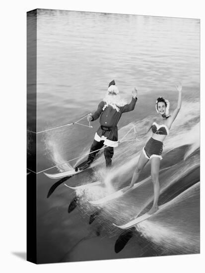 Santa Claus Water Skiing with Female Friend-null-Premier Image Canvas
