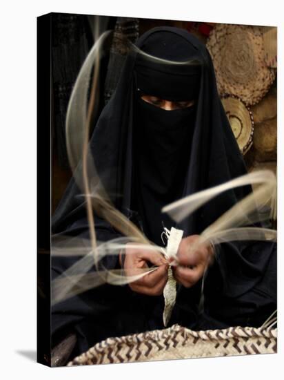 Saudi Woman Works to Demonstrate Her Craft as She Makes a Cane Box at a Fair in Riyadh-null-Premier Image Canvas