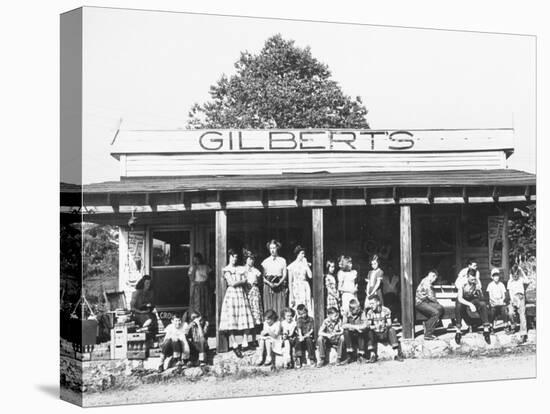 School Children Waiting for the Bus at the General Store-Ralph Crane-Premier Image Canvas