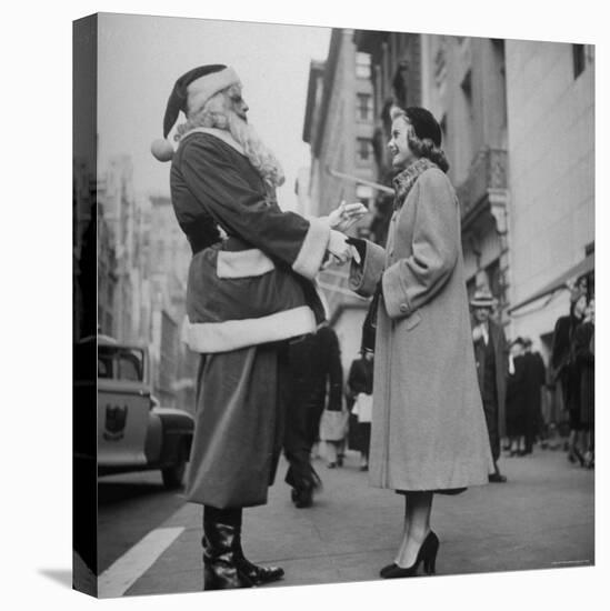 Secretary Eileen Godsil Talking with a Department Store Santa Claus on 5th Avenue-Martha Holmes-Premier Image Canvas