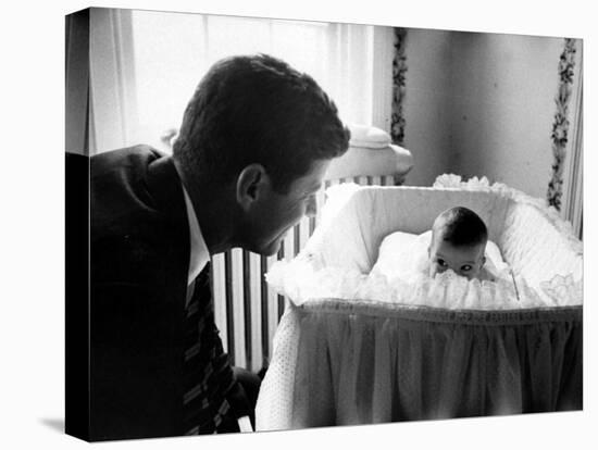 Sen. John F. Kennedy Playing Peek-A-Boo with His Daughter Caroline in Her Crib-Ed Clark-Premier Image Canvas