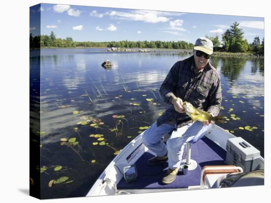 Senior Man Holding a Fish-null-Premier Image Canvas