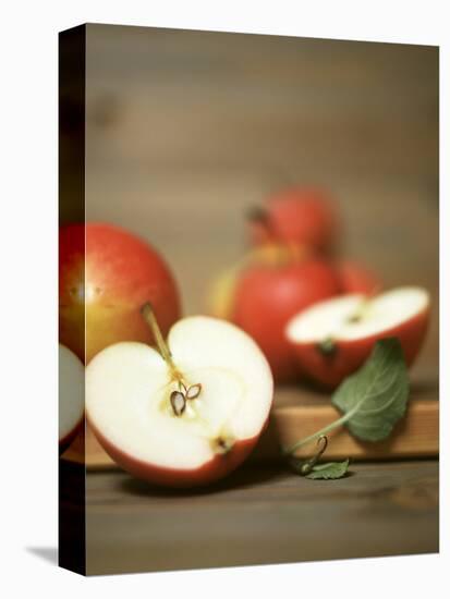 Several Apples, One Halved-Uwe Bender-Premier Image Canvas