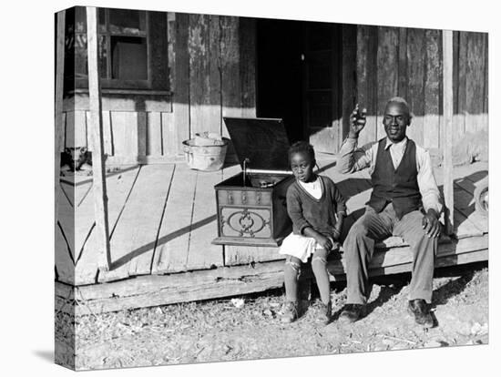 Sharecropper, Lonnie Fair and Daughter Listen to Victrola on Farm in Mississippi-Alfred Eisenstaedt-Premier Image Canvas