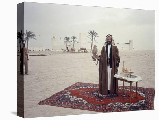 Sheik Shakbut Bin Sultan Al Nahyan Standing in Front of His Palace Holding a Falcon, 1963-Ralph Crane-Premier Image Canvas
