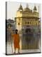 Shrine Guard in Orange Clothes Holding Lance Standing by Pool in Front of the Golden Temple-Eitan Simanor-Premier Image Canvas