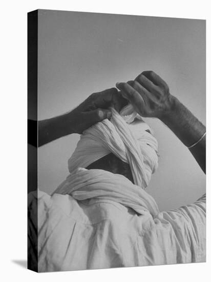 Sikh Man Demonstrating How He Finishes the Winding of His Traditional Turban around His Head-Margaret Bourke-White-Premier Image Canvas