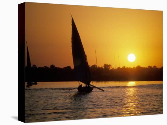 Silhouette of a traditional Egyptian Falucca, Nile River, Luxor, Egypt-Janis Miglavs-Premier Image Canvas