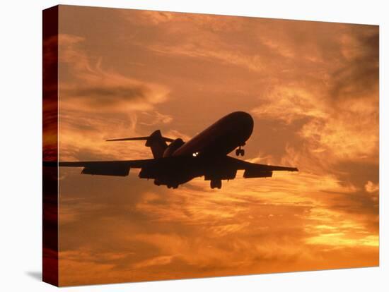 Silhouette of Commercial Airplane at Sunset-Mitch Diamond-Premier Image Canvas