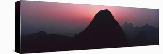 Silhouette of rock formations at dusk, Seven Star Park, Guilin, China-Panoramic Images-Premier Image Canvas