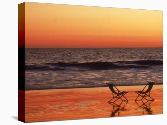 Silhouette of Two Chairs on the Beach-Mitch Diamond-Premier Image Canvas