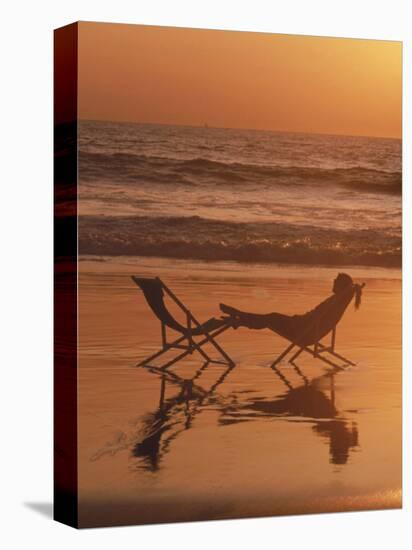 Silhouette of Woman in Beach Chair on the Beach-Mitch Diamond-Premier Image Canvas